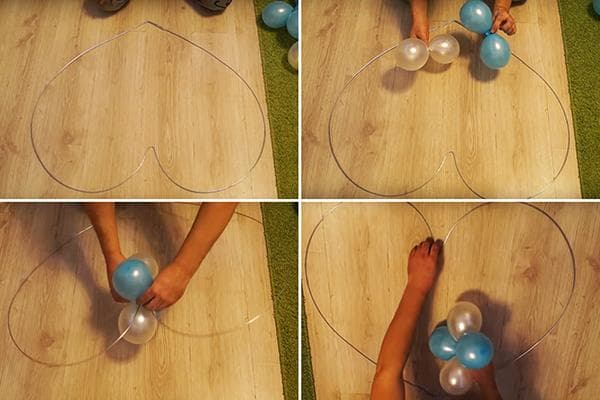 Befestigung der Luftballons am herzförmigen Rahmen