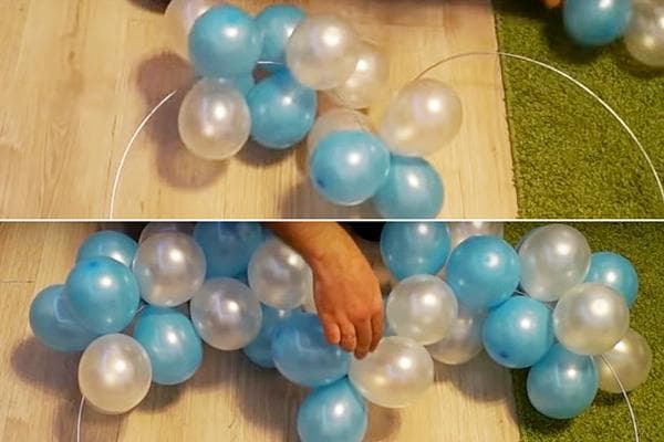 Formung eines Herzens aus Luftballons auf einem Drahtrahmen