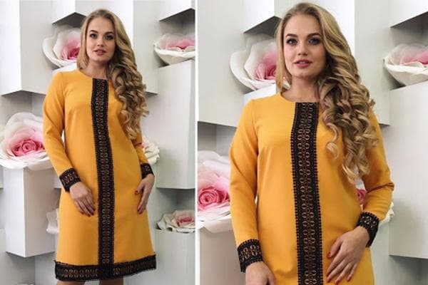 Durch einen Spitzeneinsatz vergrößertes Kleid